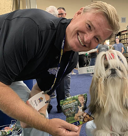 Pet Treats Ernie at SuperZoo with little dog.jpg